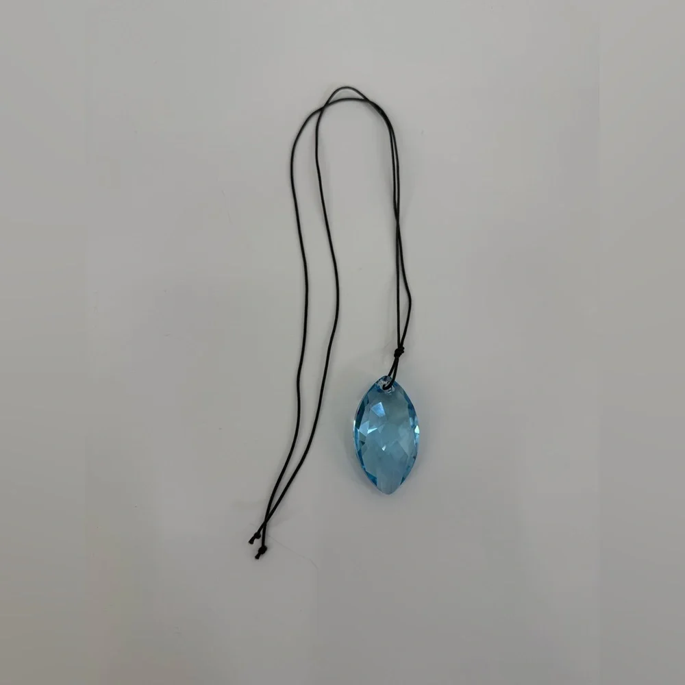 SWAROVSKI Aqua Scuro Crystal Teardrop Pendant Necklace On Black Cord-5083475